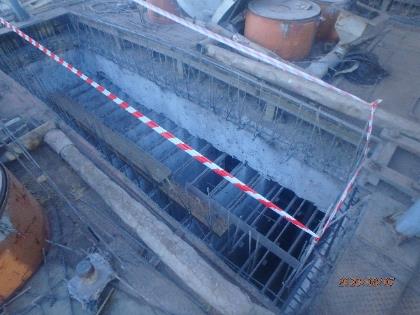 Demolished concrete and bent-up rebar in preparation for installation